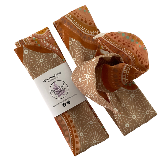 Sacred Country Wire Headwrap by Holly Sanders. Handmade cotton headwrap featuring contemporary Aboriginal art representing spiritual connection to Country and sacred sites.