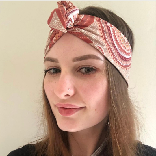 A styled image of a lady wearing the Sacred Country Wire Headwrap.