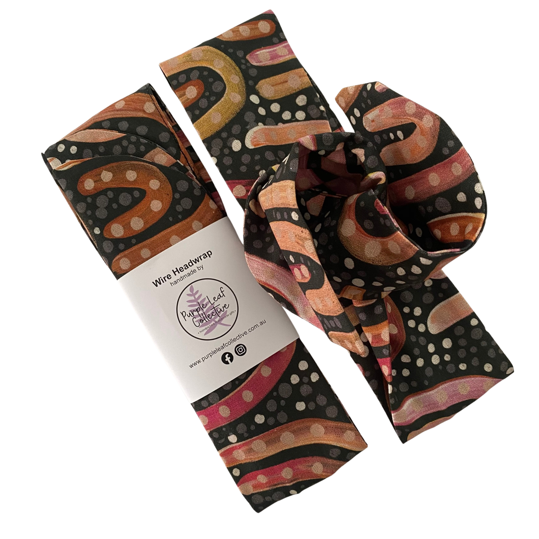 Contemporary Aboriginal art wire headwrap by Holly Sanders, depicting sacred sandhill landscapes on woven cotton fabric.