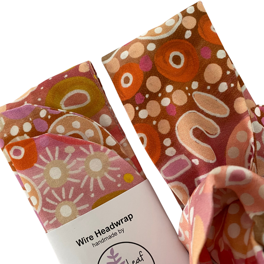 Close up view of our Women On Country wire headwrap with artwork by Holly Sanders.