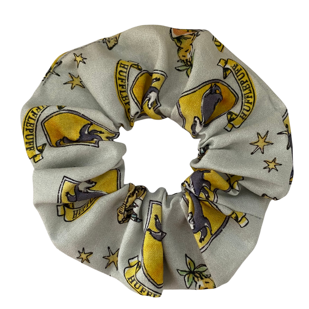 Harry Potter Hufflepuff House Scrunchie featuring the signature yellow and black tones of Hufflepuff.