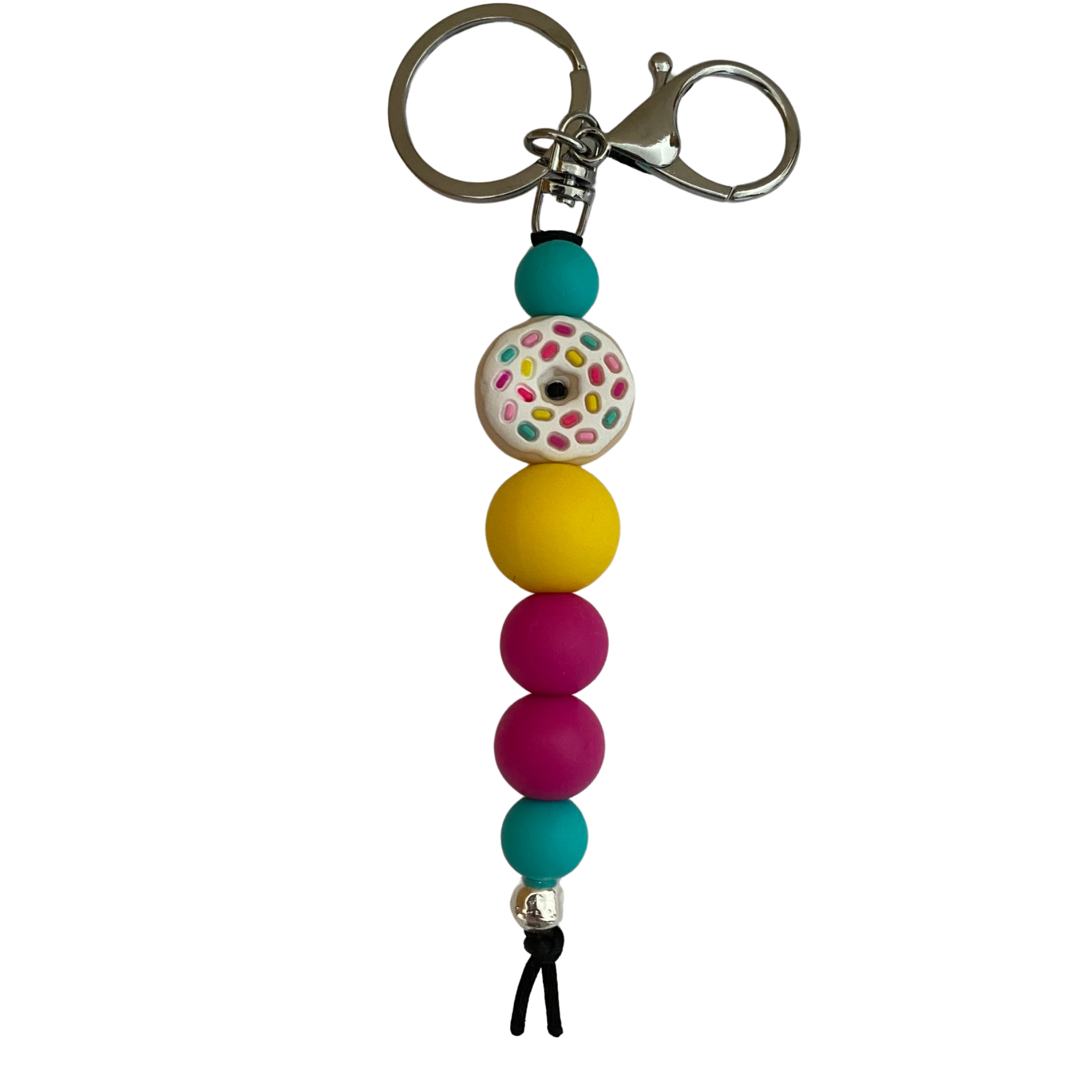 Iced Donut Silicone Keyring, featuring a super cute donut bead topped with icing and colourful sprinkles, it’s paired with bright yellow, turquoise, and hot pink silicone beads for a pop of playful colour.