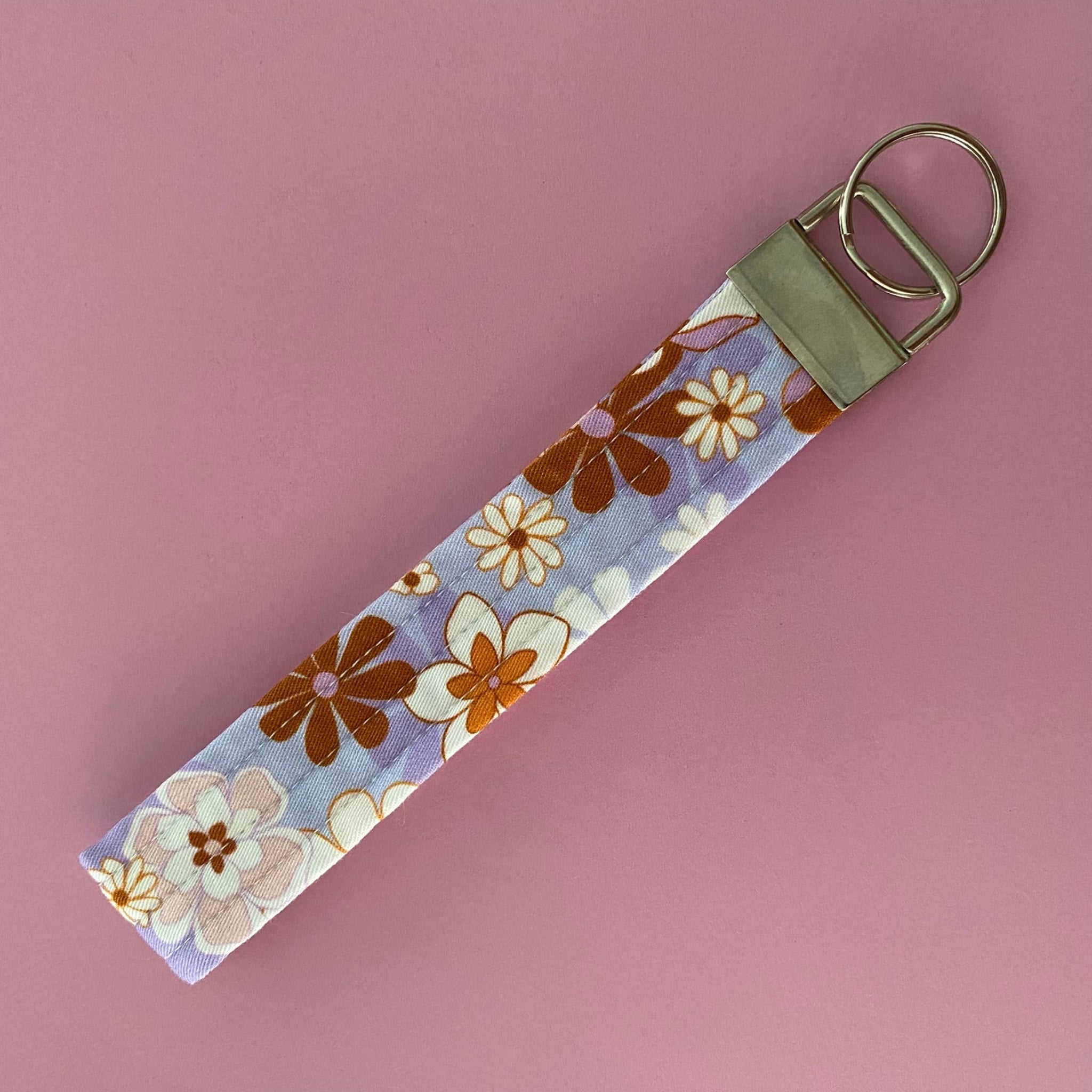 Handmade Jac Slade Retro Blooms Lilac Periwinkle fabric key fob wristlet, featuring a durable quilted design for easy key access and hands-free use. Perfect for on-the-go!