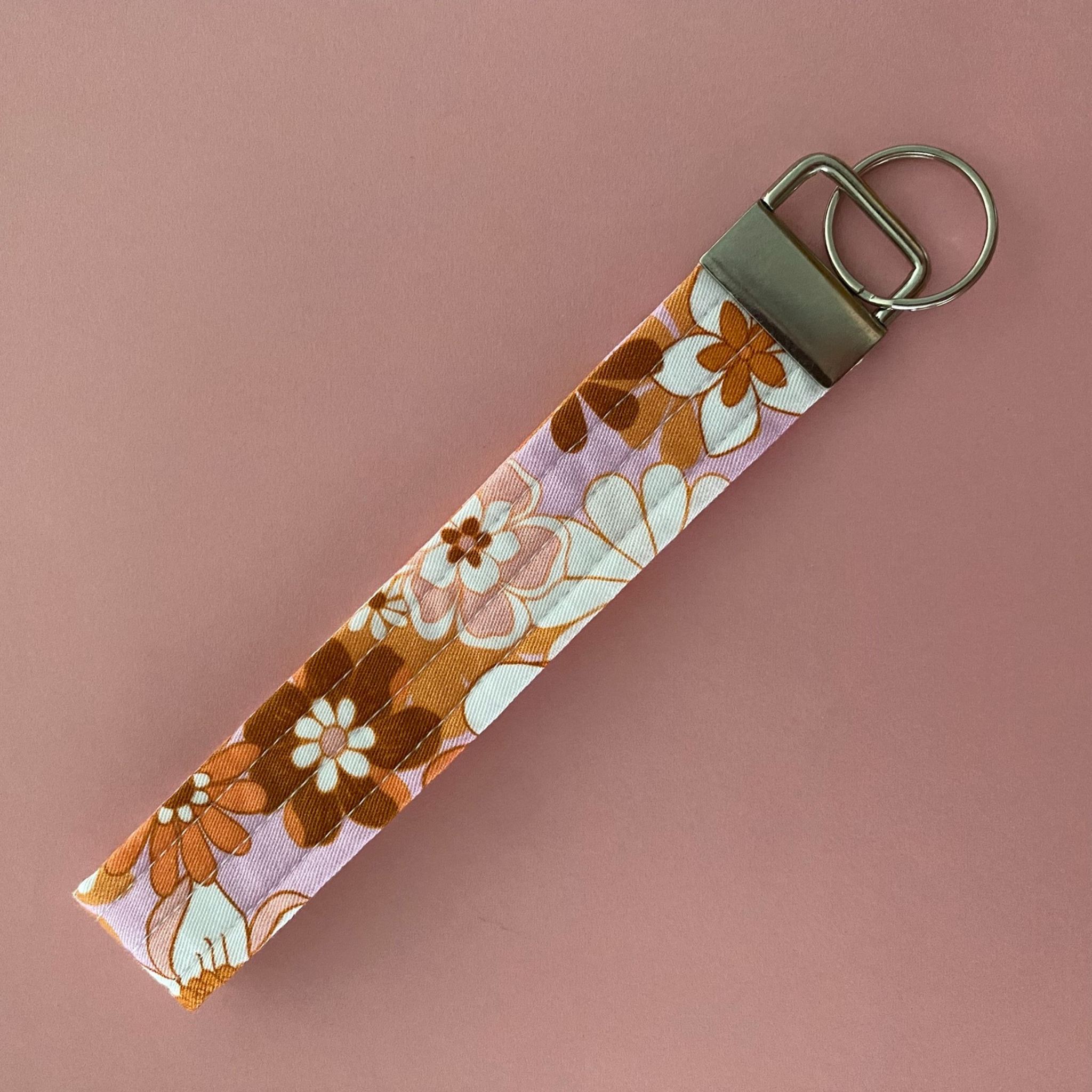 Handmade Jac Slade Retro Blooms Pink Blush fabric key fob wristlet, featuring a durable quilted design for easy key access and hands-free use. Perfect for on-the-go!