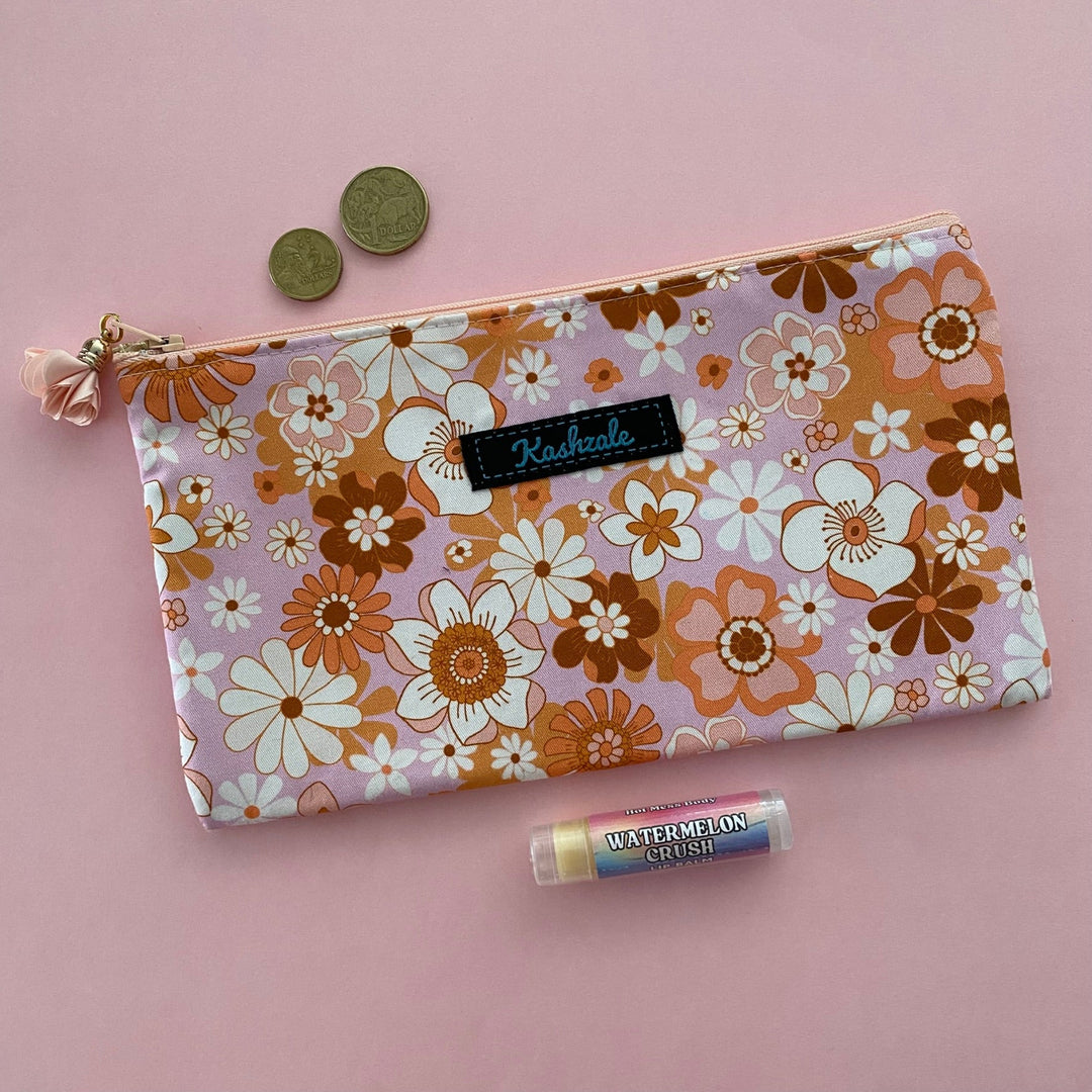 Our Retro Blooms Pink Blush large zipper pouch, featuring fabric designed by Jac Slade, is fully lined and perfectly sized for a passport, travel pouch, pencil case, cosmetic bag, makeup brush holder or handbag organiser for small essentials. 