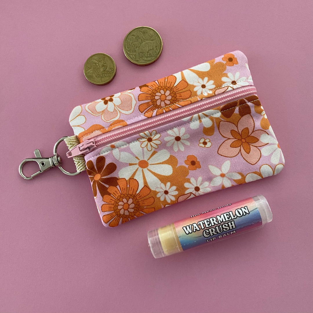 A small clip coin purse perfect for coins and small essentials featuring fabric in retro blooms and pink blush colour by Jac Slade. 