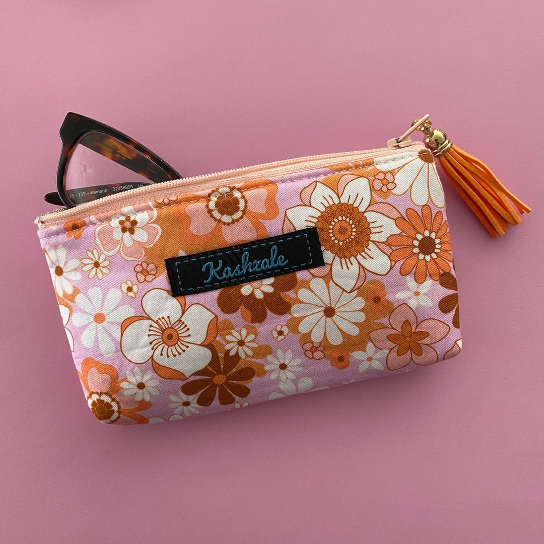 Protect your glasses with our padded, fully lined glasses case featuring colourful retro flowers on pink fabric by Jac Slade. Perfect pouch for eyewear and small essentials.