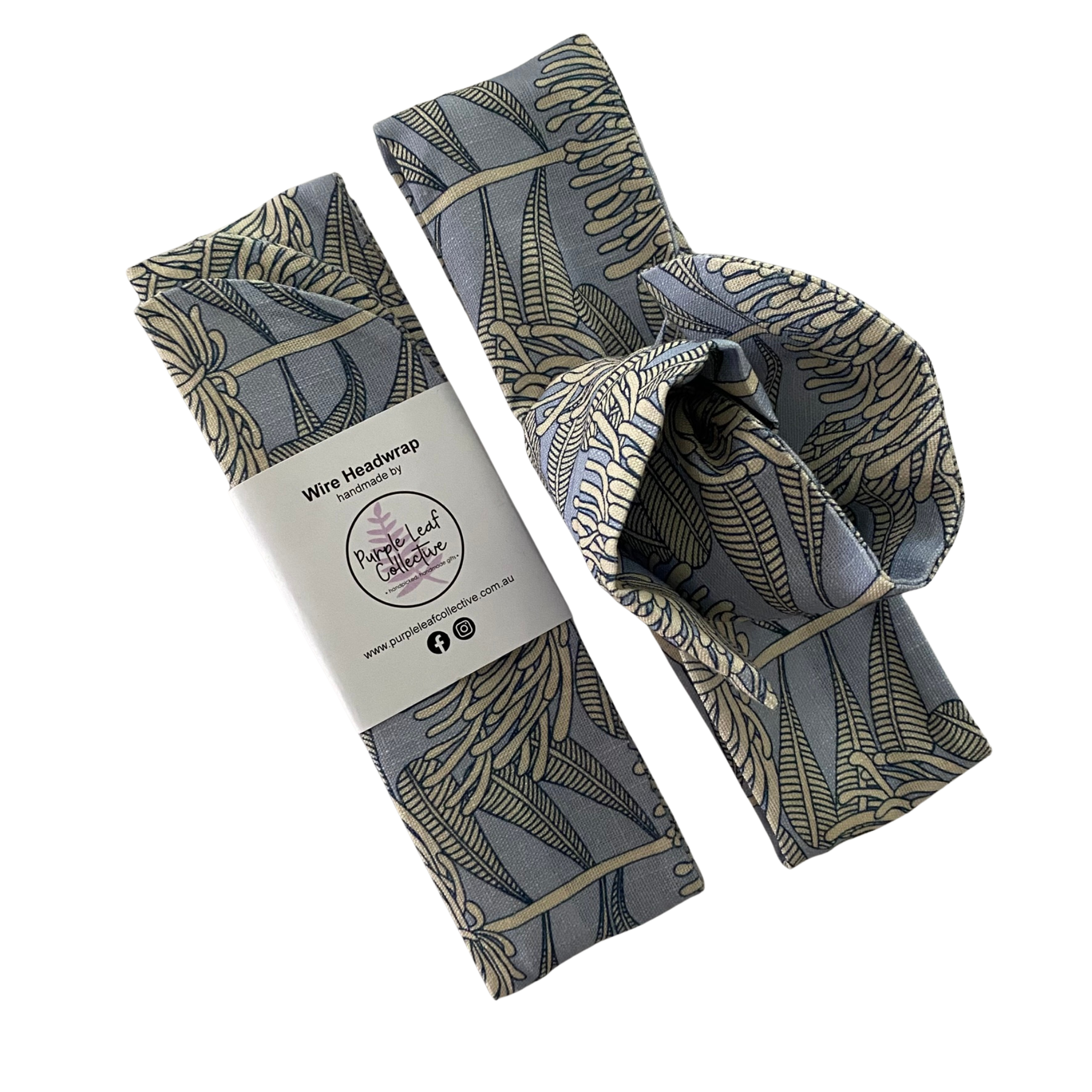 Wire headwrap features a bone waratah repeat pattern on a soft blue-grey backdrop.