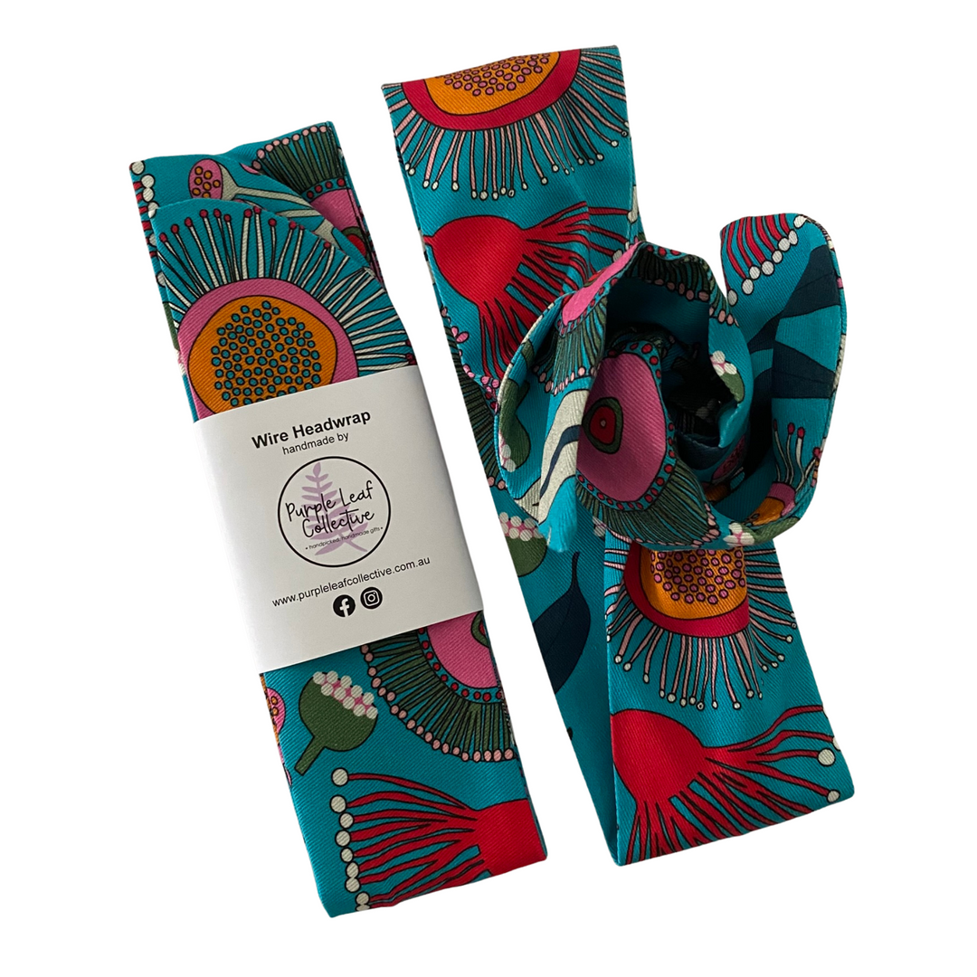 Handmade wire headwrap, headband with colourful native flowers set on teal colour fabric by Jocelyn Proust. Stylish, adjustable, and perfect for all-day wear or hair loss coverage.