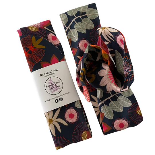 Handmade wire headwrap, headband with native flowers set on dark blue colour fabric by Jocelyn Proust. Stylish, adjustable, and perfect for all-day wear or hair loss coverage.