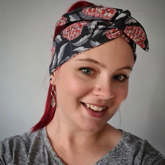 A picture of a customer wearing the Waratah Dance Wire Headwrap.