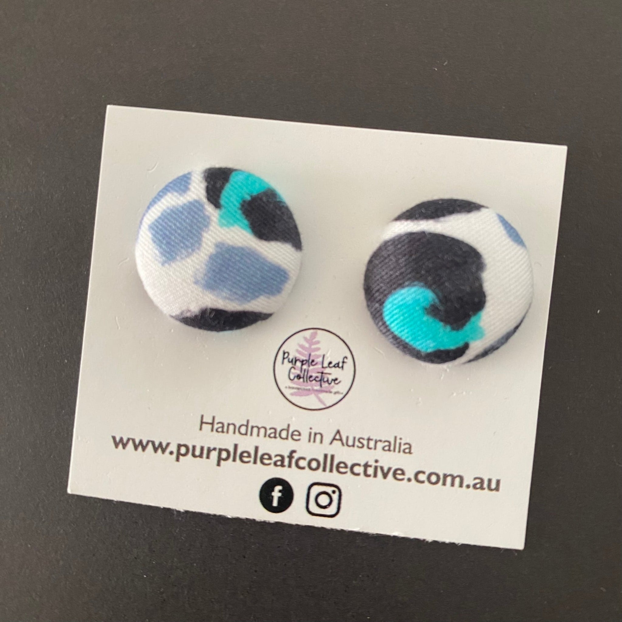 Kasey Rainbow Snow Leopard fabric button earrings, crafted with vibrant fabric designed by Kasey Rainbow. Handmade with hypoallergenic surgical steel posts which are perfect for sensitive ears.