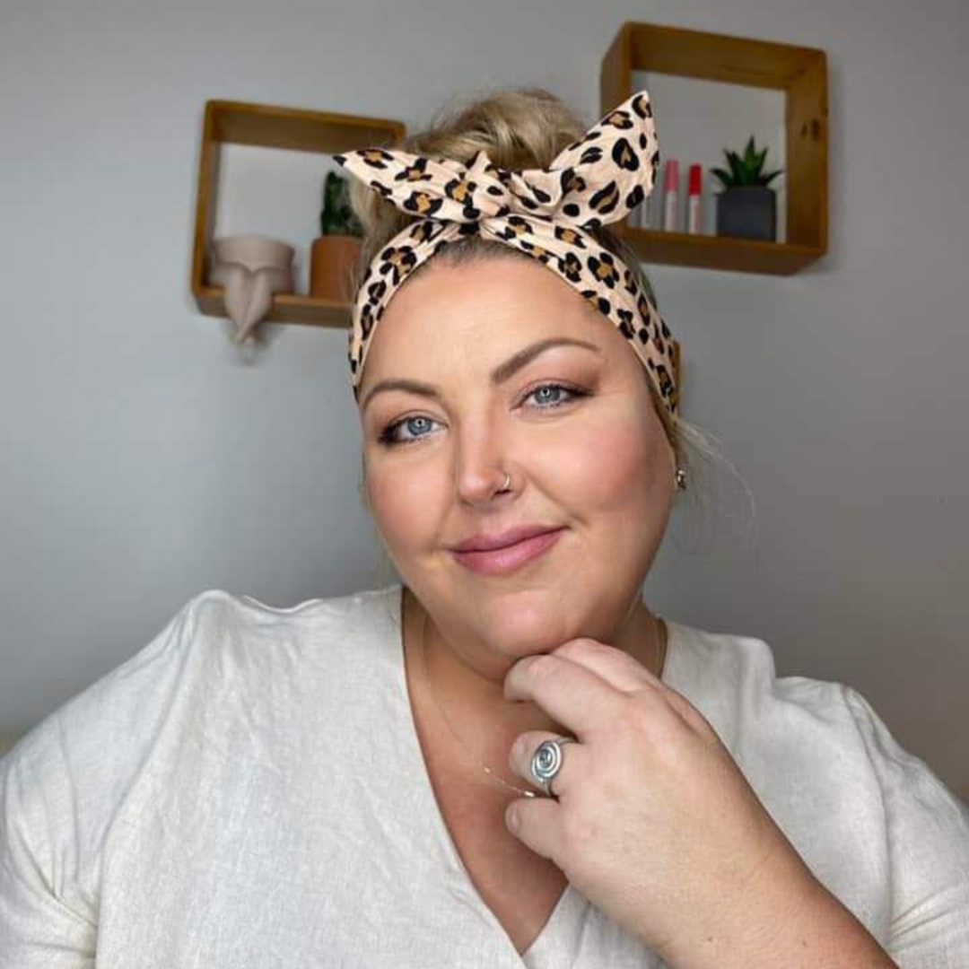 A picture of a customer wearing the Kiara Wire Headwrap.