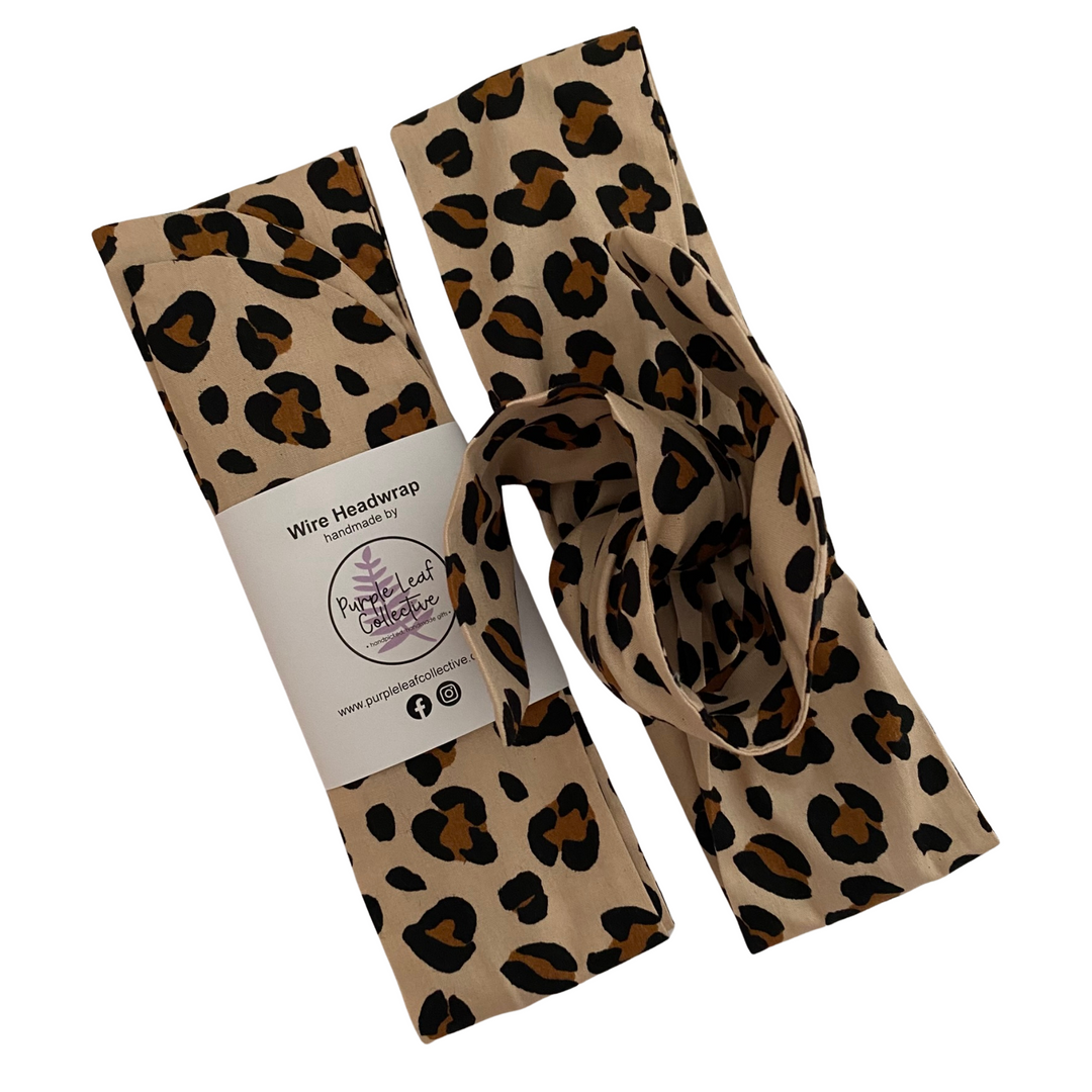 Leopard print headband with packaging on a white background.