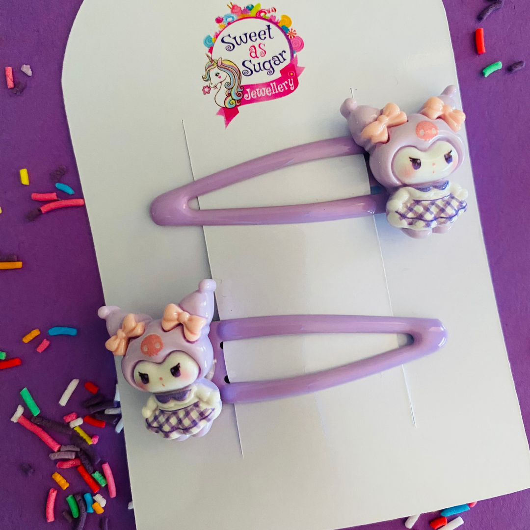 Two lilac hair clips featuring Kuromi charm.