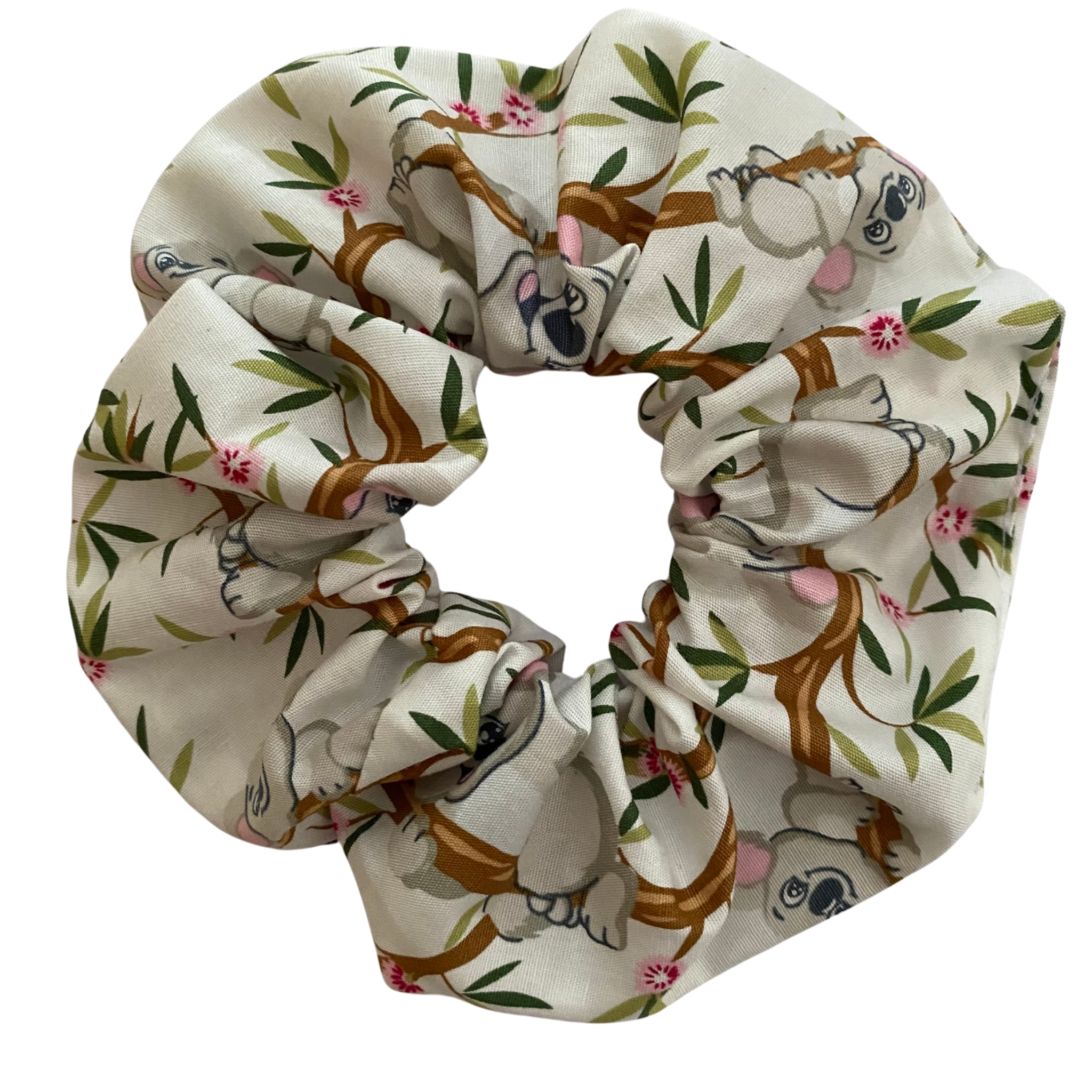 Our Koala scrunchie features koalas sitting in gum trees on white fabric.