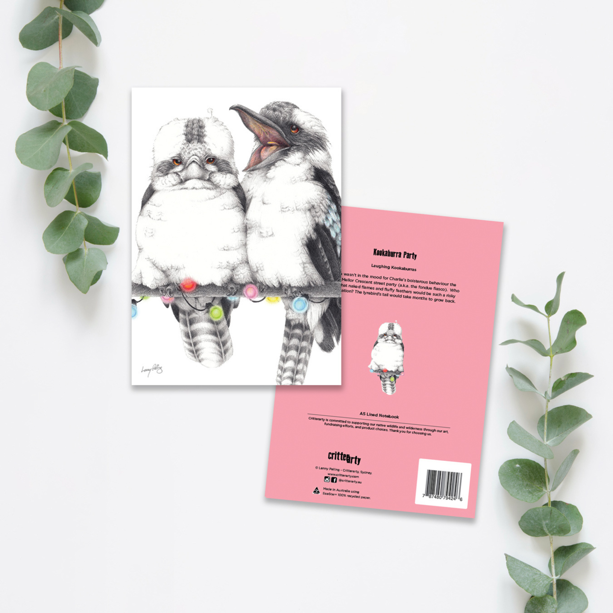 A premium hardcover notebook featuring an illustration of two laughing kookaburras perched together on a branch, set against a clean background.