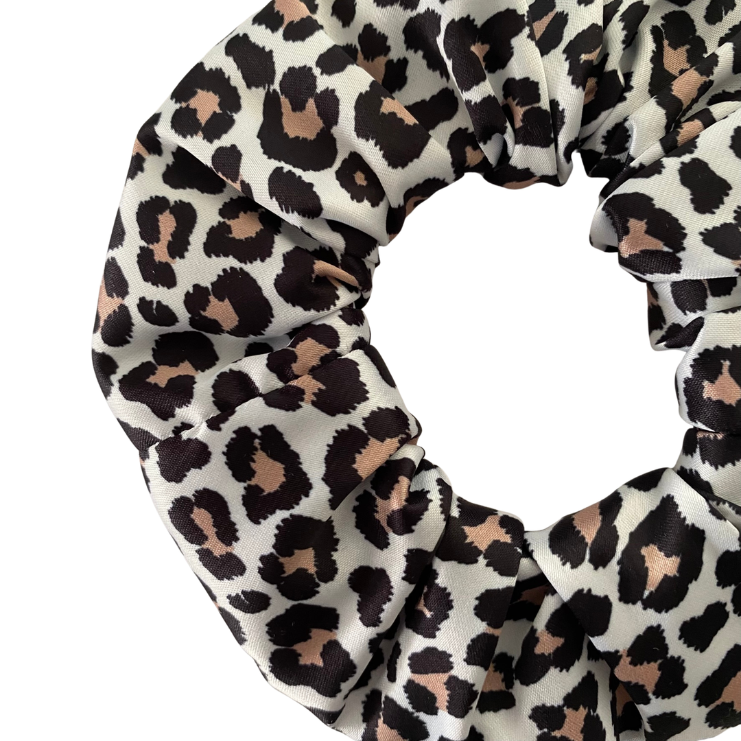Brown and Black leopard print scrunchie on a white background.