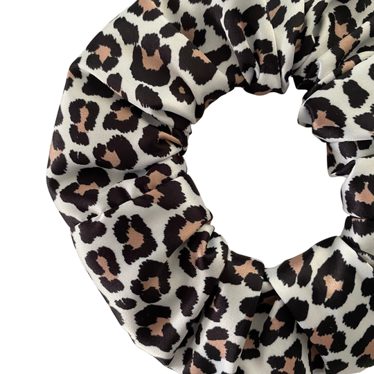 Brown and Black leopard print scrunchie on a white background.