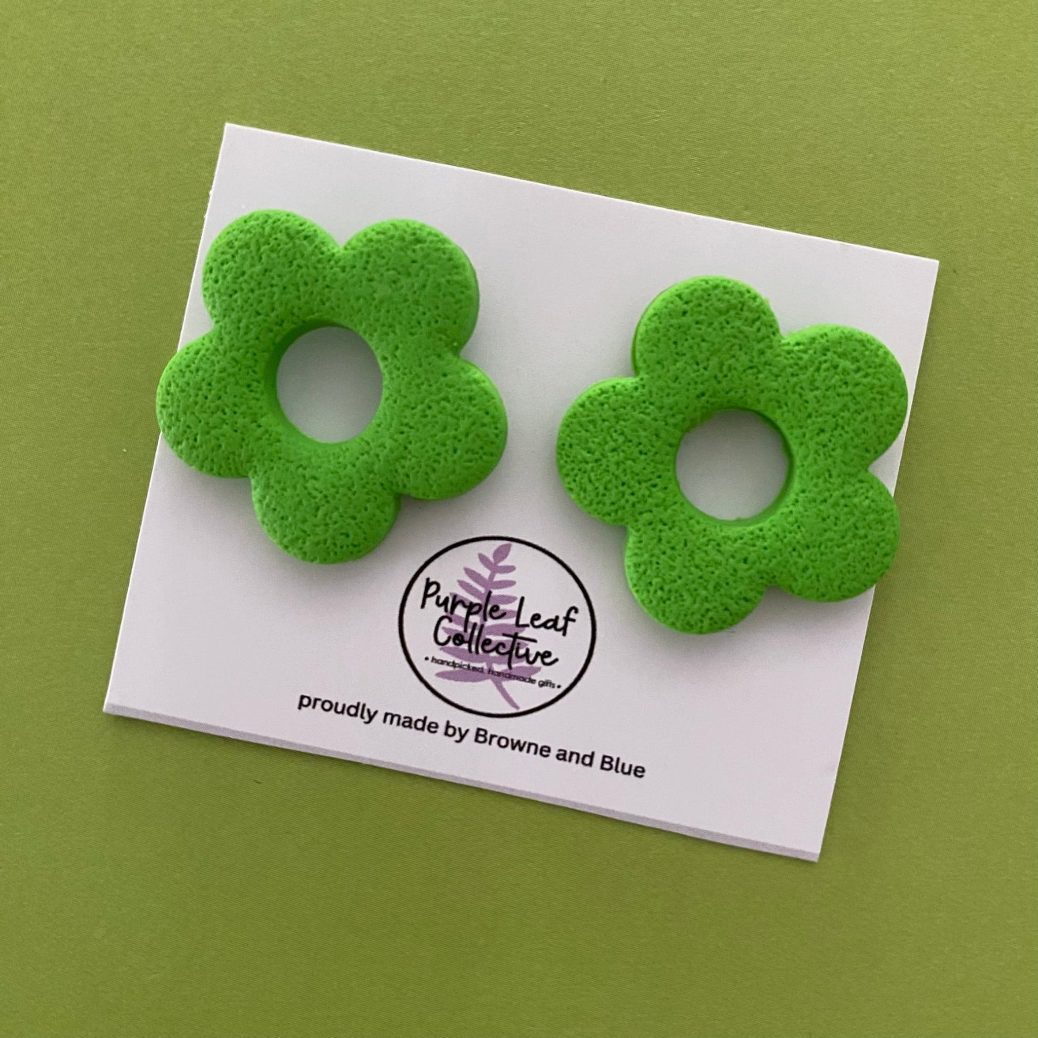 Drop stud earrings with five lime green polymer clay flower petals, set on surgical steel posts for comfort and durability.