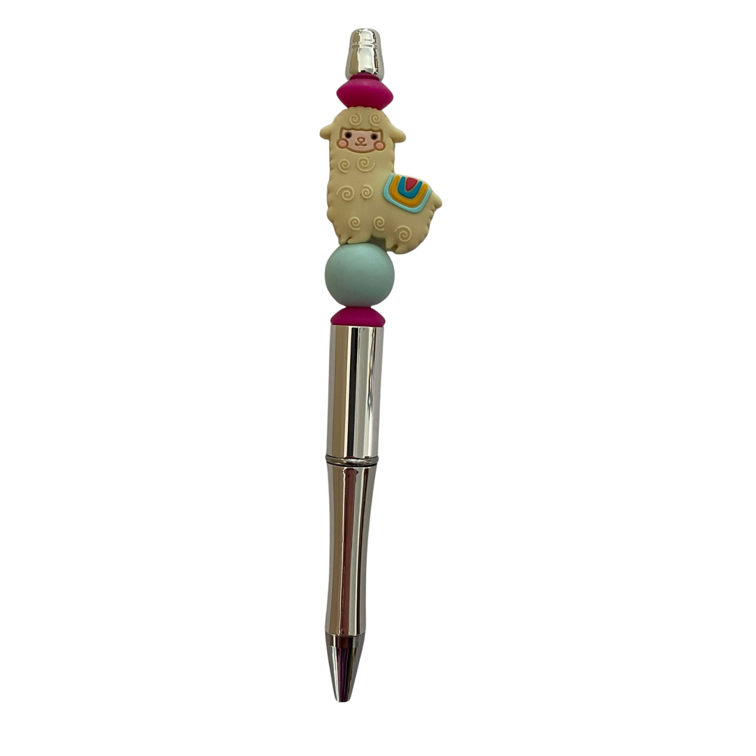 Pen with a llama silicone bead on top on a white background.