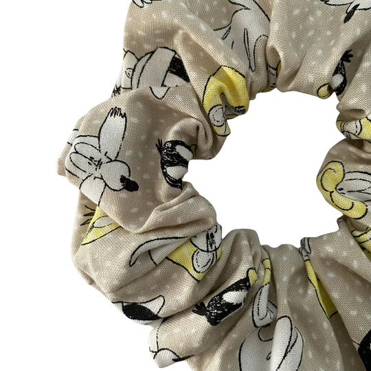 Scrunchie featuring a whimsical pattern of Bugs Bunny, Tweety Bird and Daffy Duck on a light grey cotton.