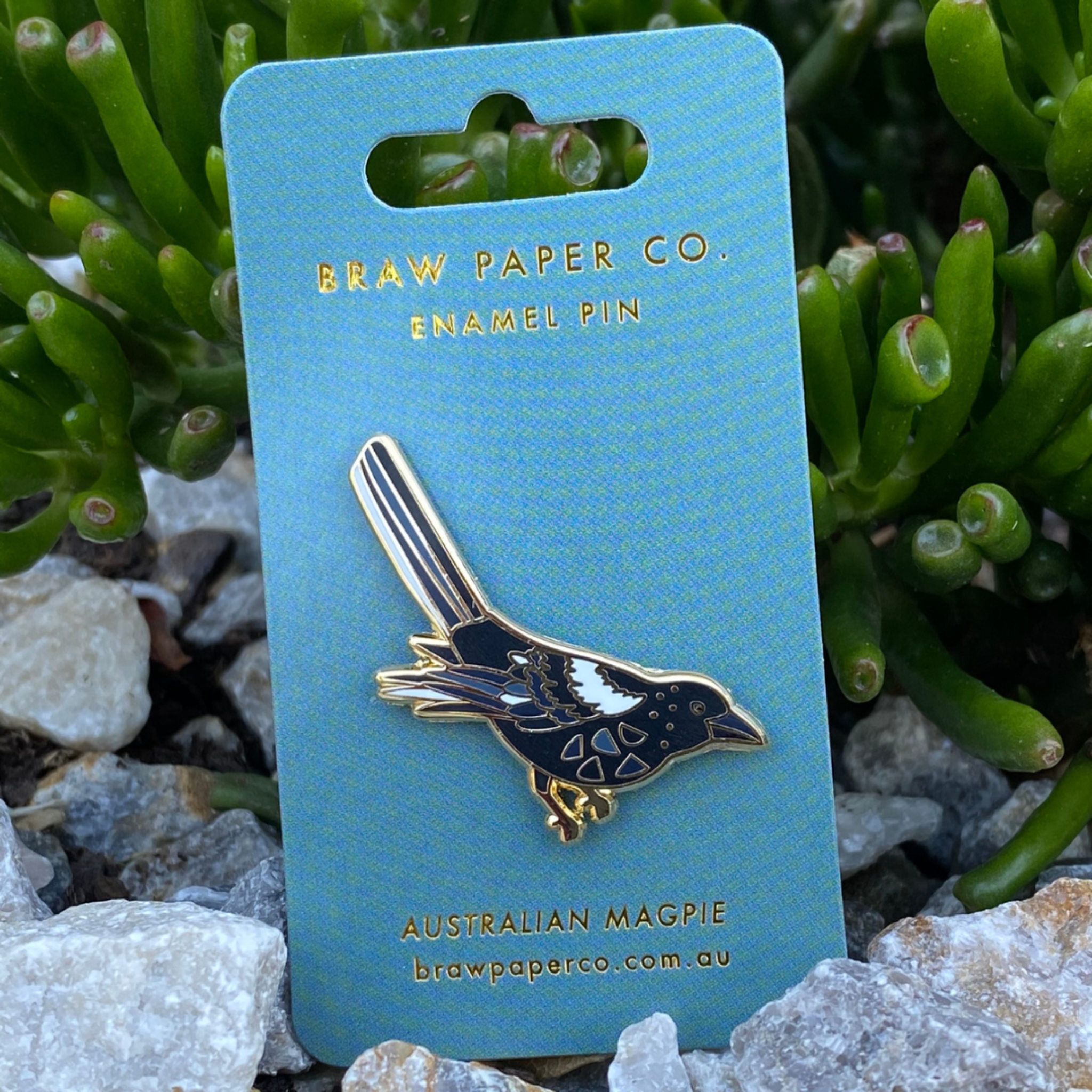 The Magpie Enamel Pin, boasting exquisite detailing and a striking design inspired by this iconic yet friendly bird.