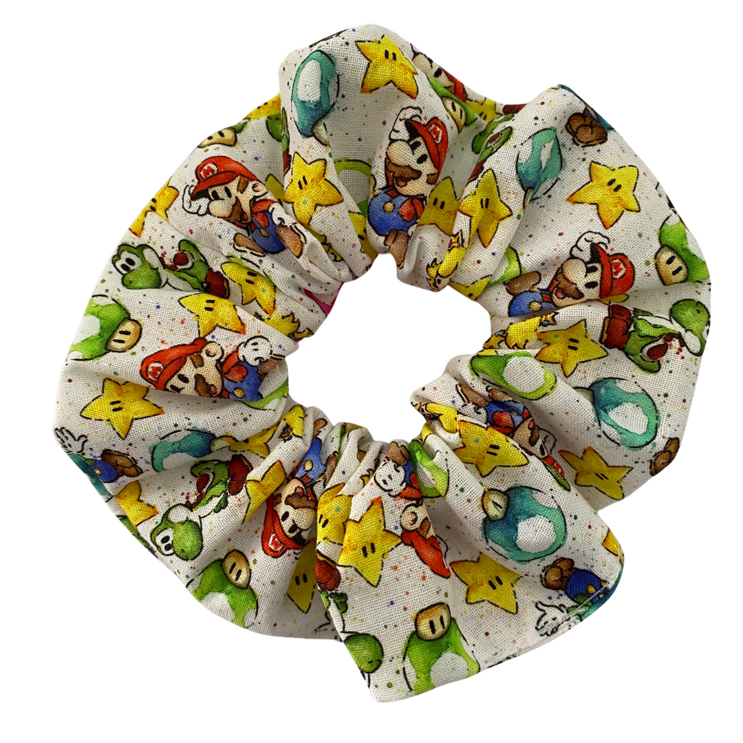 Scrunchie featuring images of Mario and Luigi, Mushroom Kingdom, Princess Peach on a cream fabric.