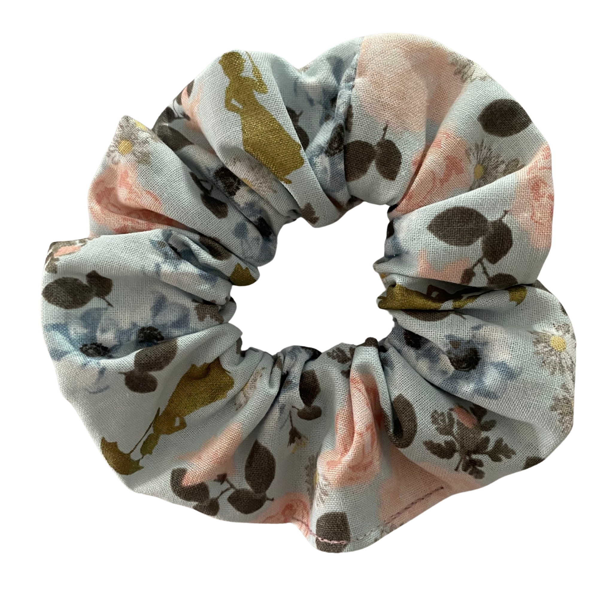 A scrunchie hair tie handmade with cotton woven fabric with images of Mary Poppins in Gold Metallic set on a blue background with blossom flowers.