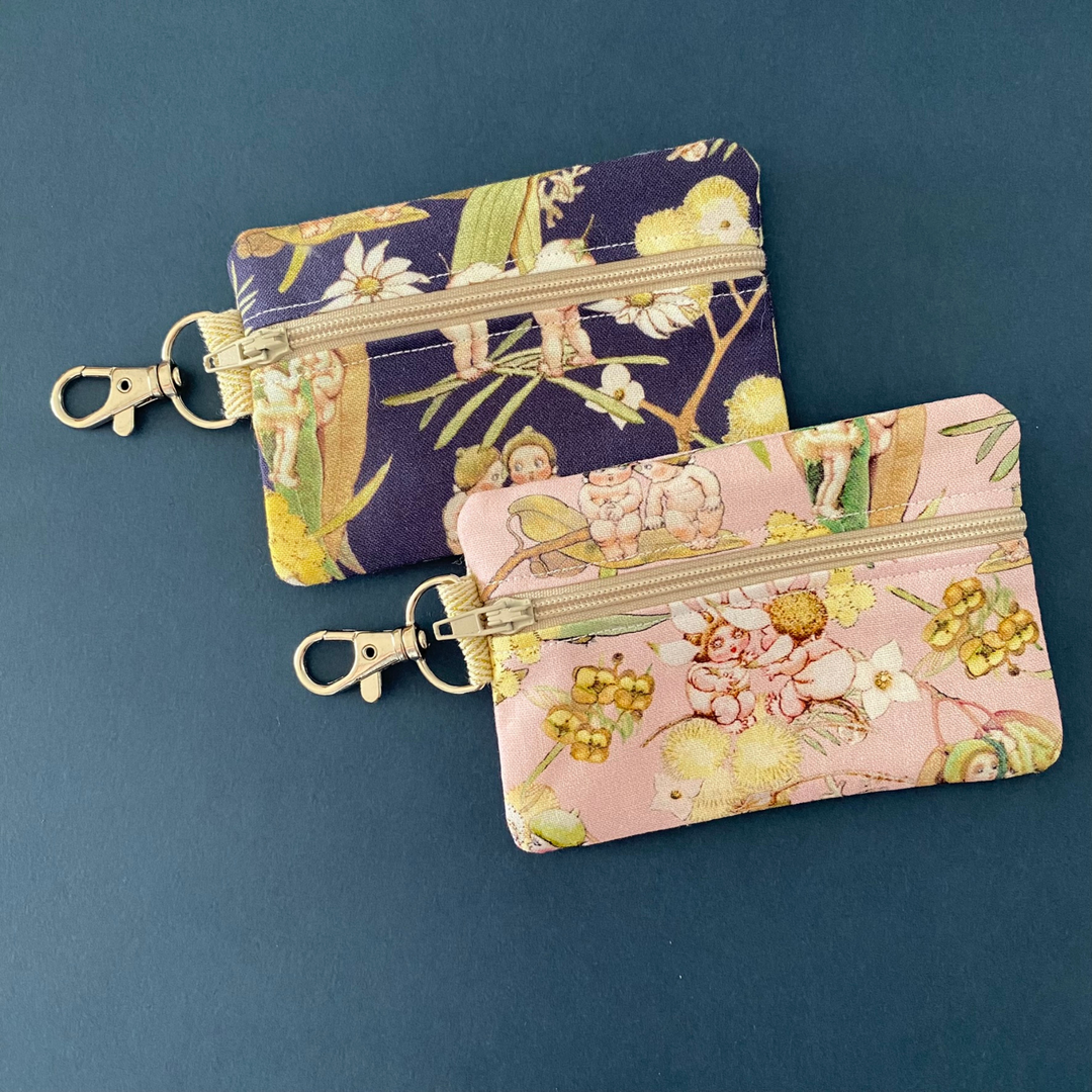 A small clip coin purse perfect for coins and small essentials featuring May Gibbs Gumnut Babies fabric.