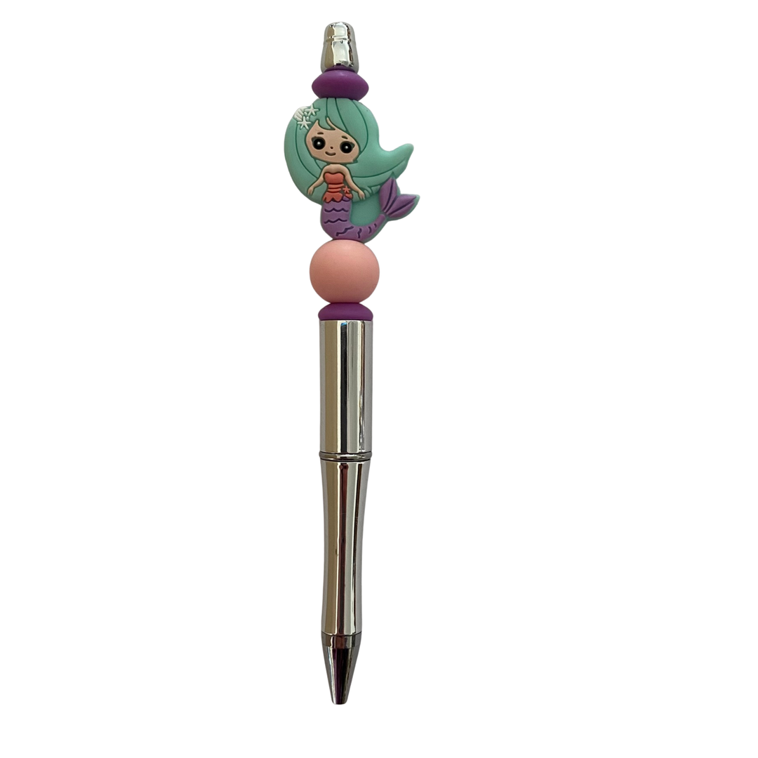 Pen with a mermaid mint green silicone bead on top on a white background.