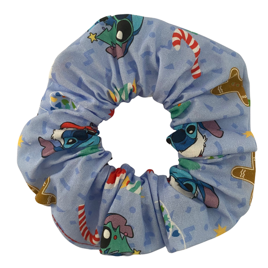A light blue scrunchie with images of Stitch and other festive images.