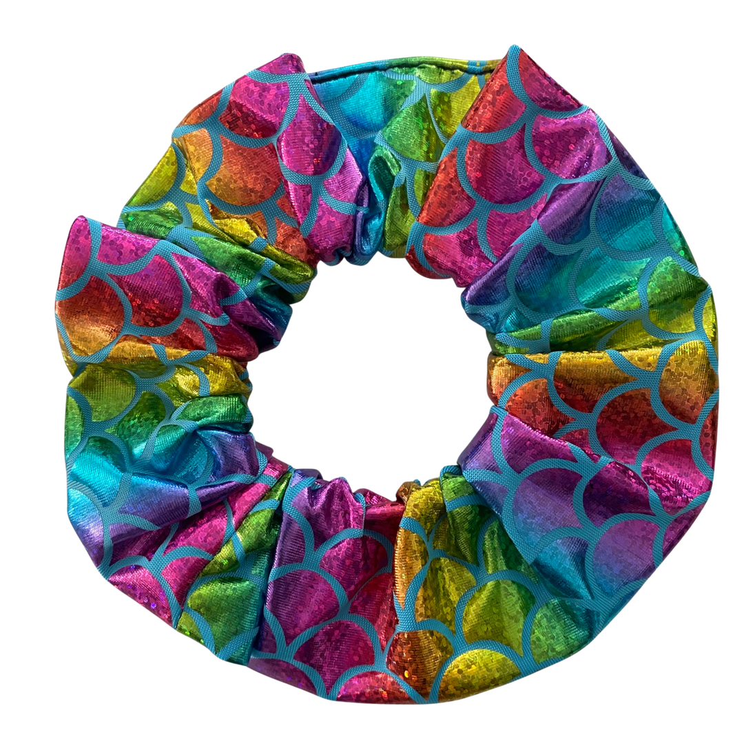 A full view of a handmade Metallic Rainbow Scales Scrunchie featuring vibrant, multi-coloured mermaid scales with a high-shine finish.