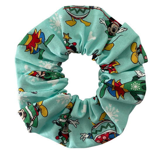 Scrunchie with images of Mickey, Minnie, Donald, Daisy and Goofy on a aqua fabric.