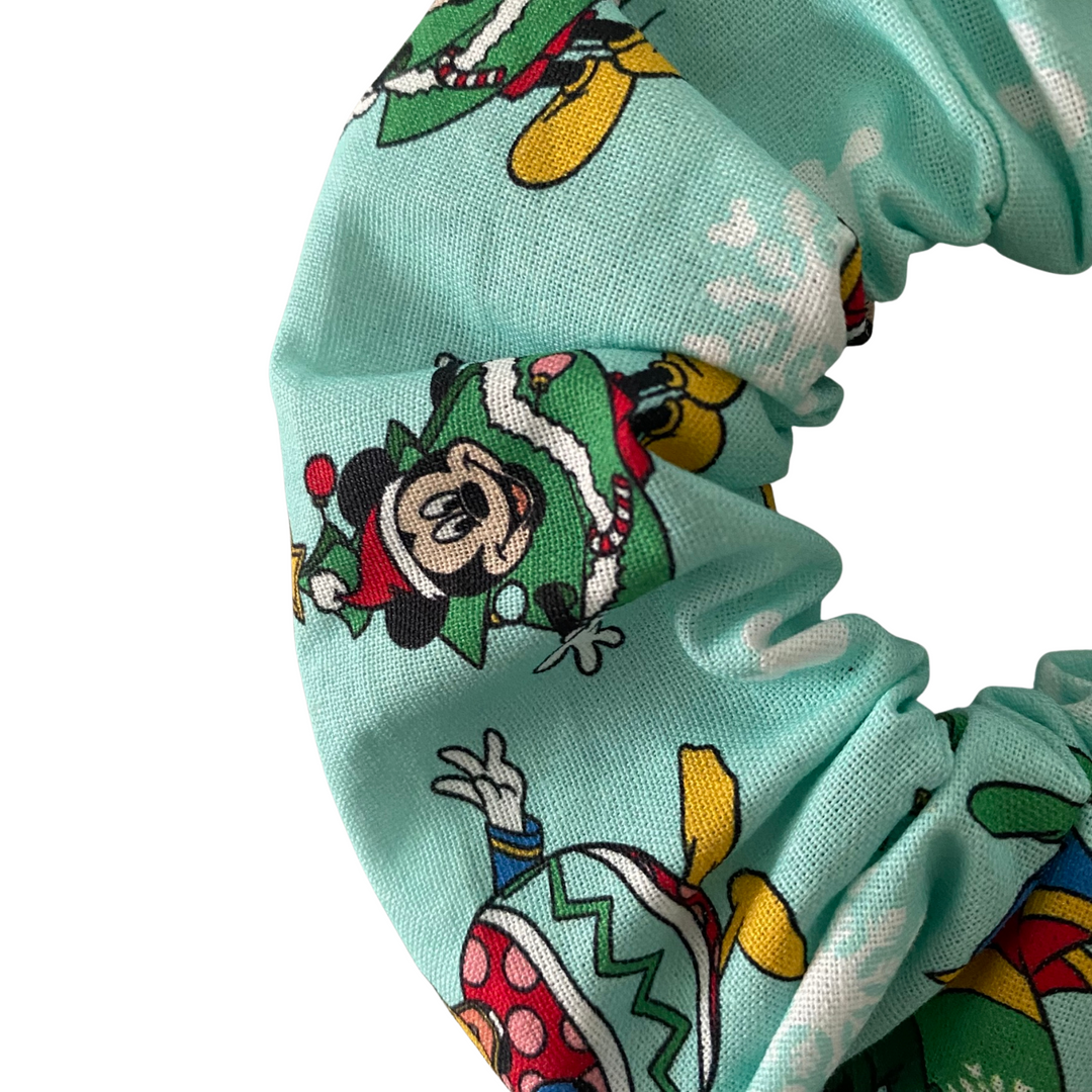 Aqua fabric scrunchie with images of Mickey, Minnie, Donald, Daisy and Goofy.