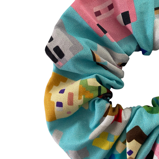 A fun pixelated block design scrunchie inspired by the world of Minecraft.