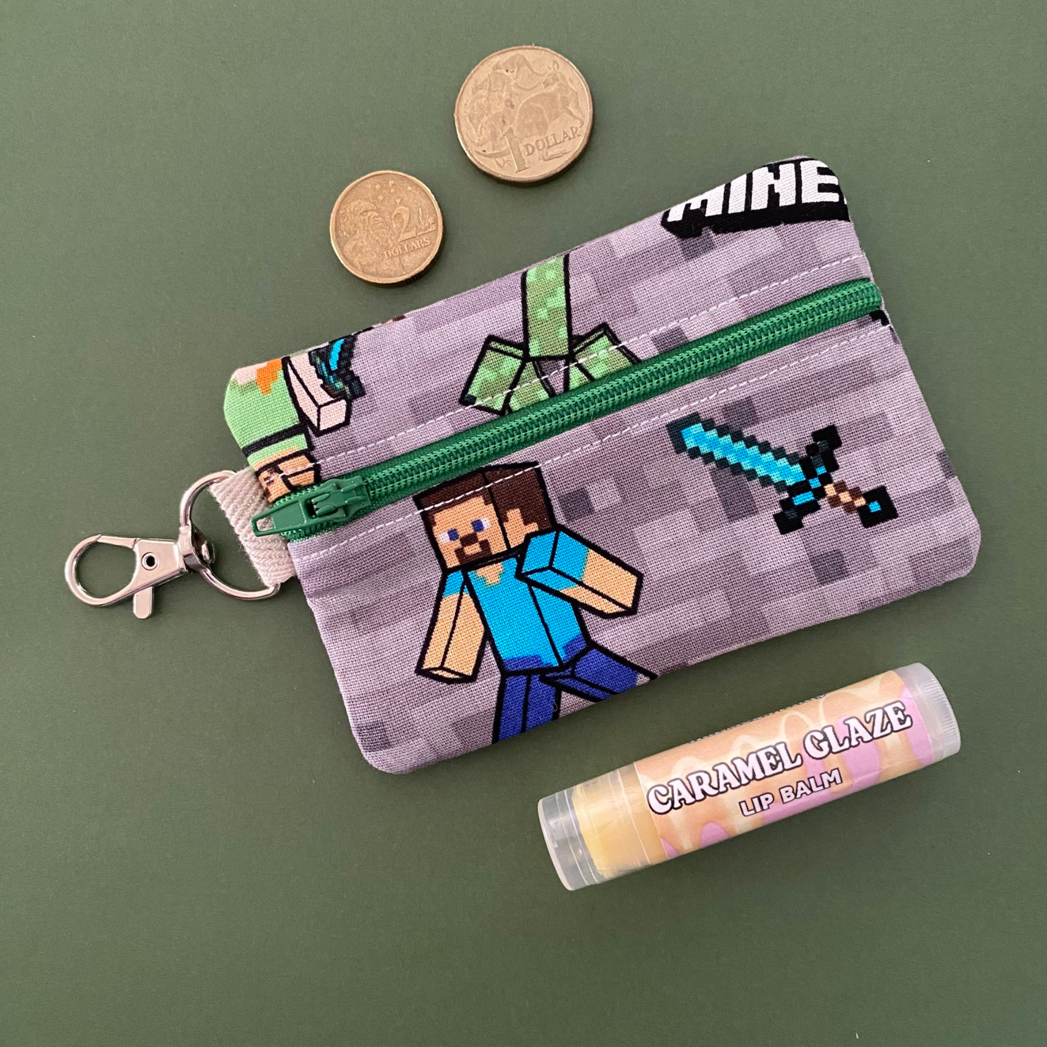 A clip coin purse featuring images of Minecraft characters.