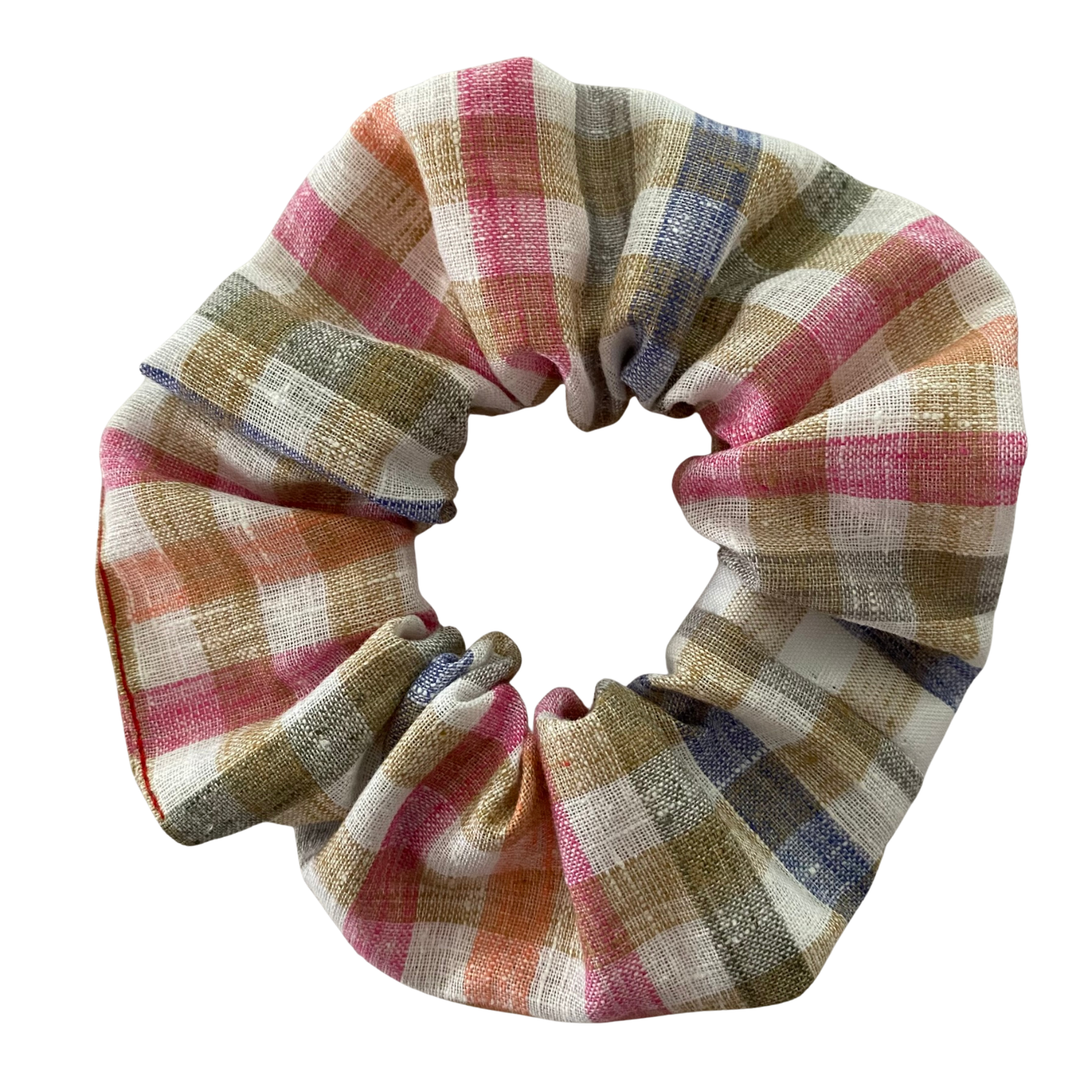Plaid patterned scrunchie on a white background.