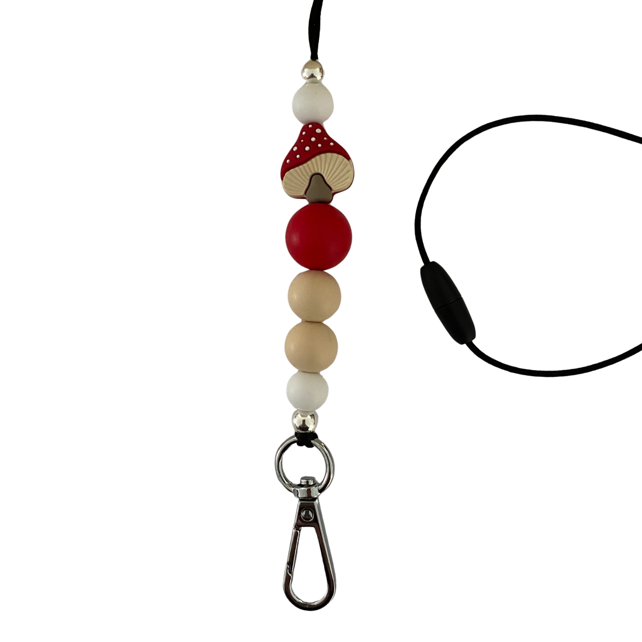A 60cm black cord lanyard with breakaway clasp with a red mushroom and white polka dots silicone bead and other coloured silicone beads.