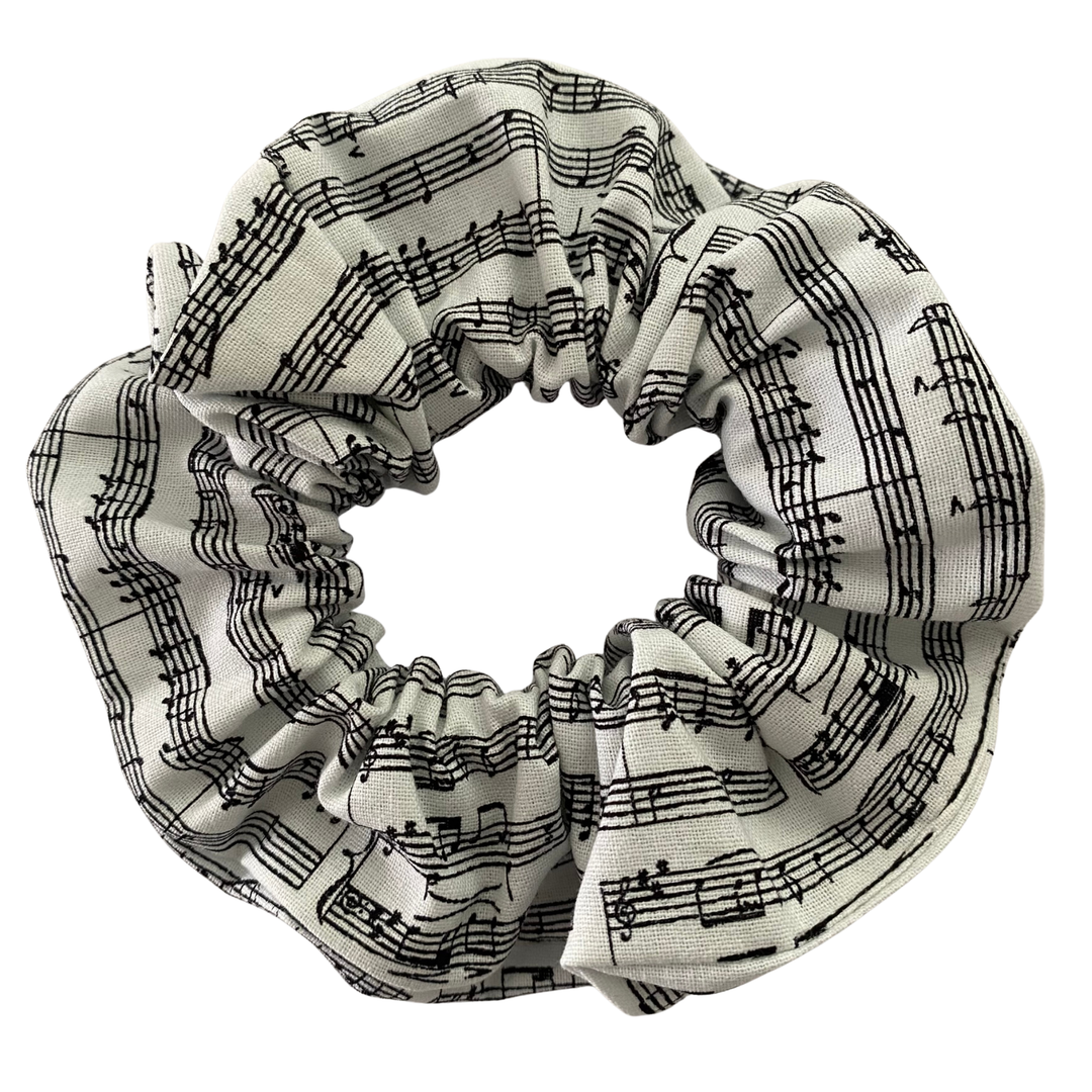 Scrunchie with black music notes on a white background.