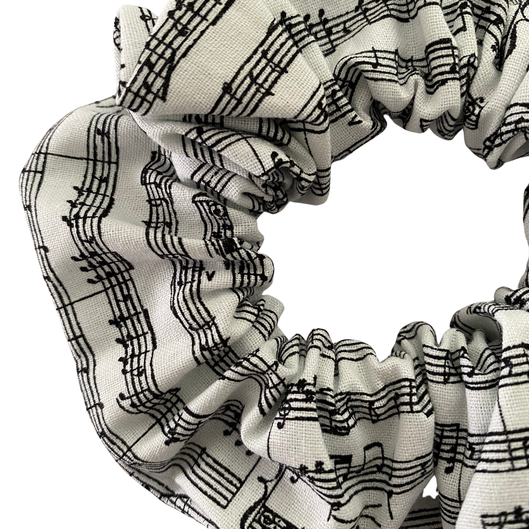 Scrunchie with music note pattern on a white background.