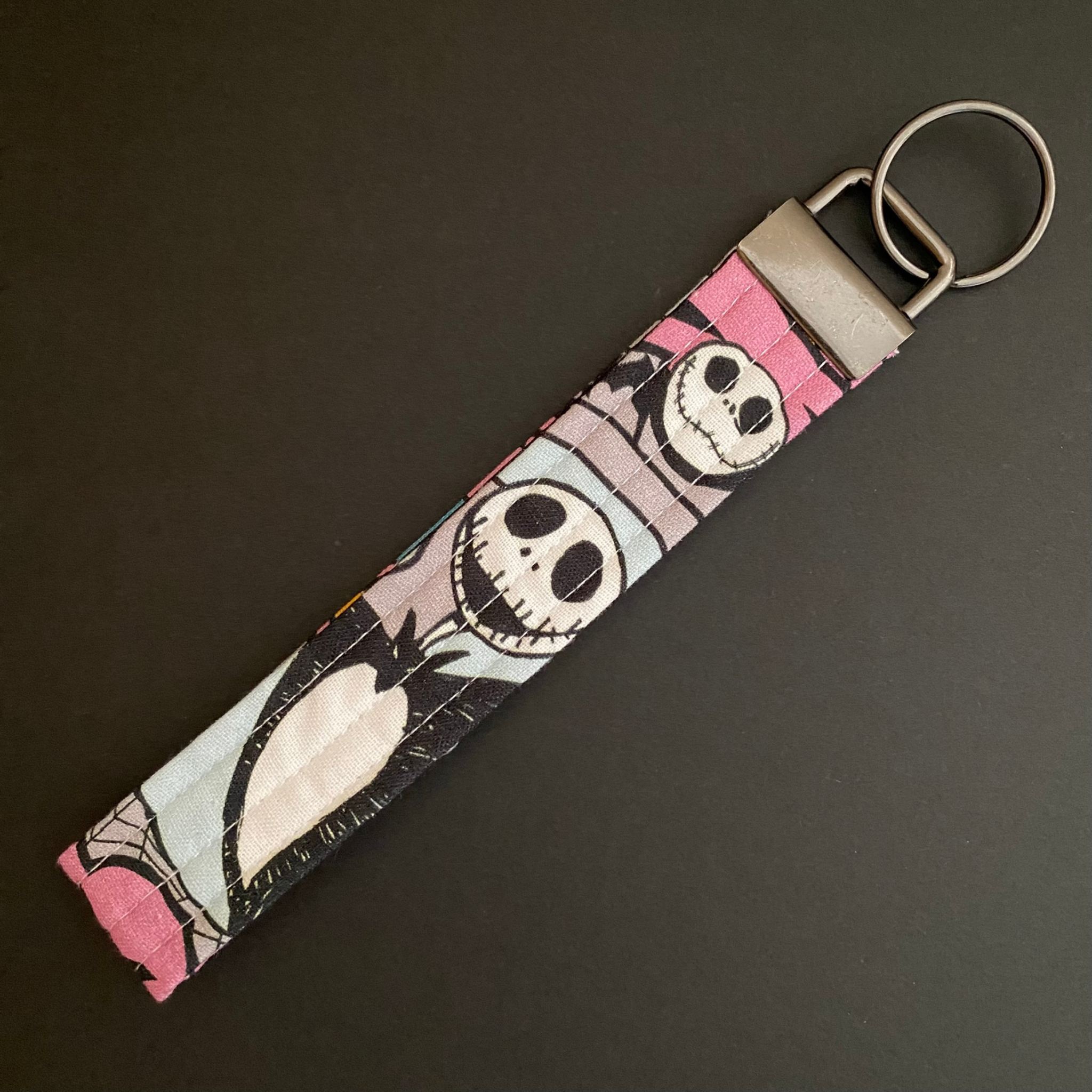 Handmade Nightmare Before Christmas fabric key fob wristlet—quilted, durable, and perfect for hands-free key access.