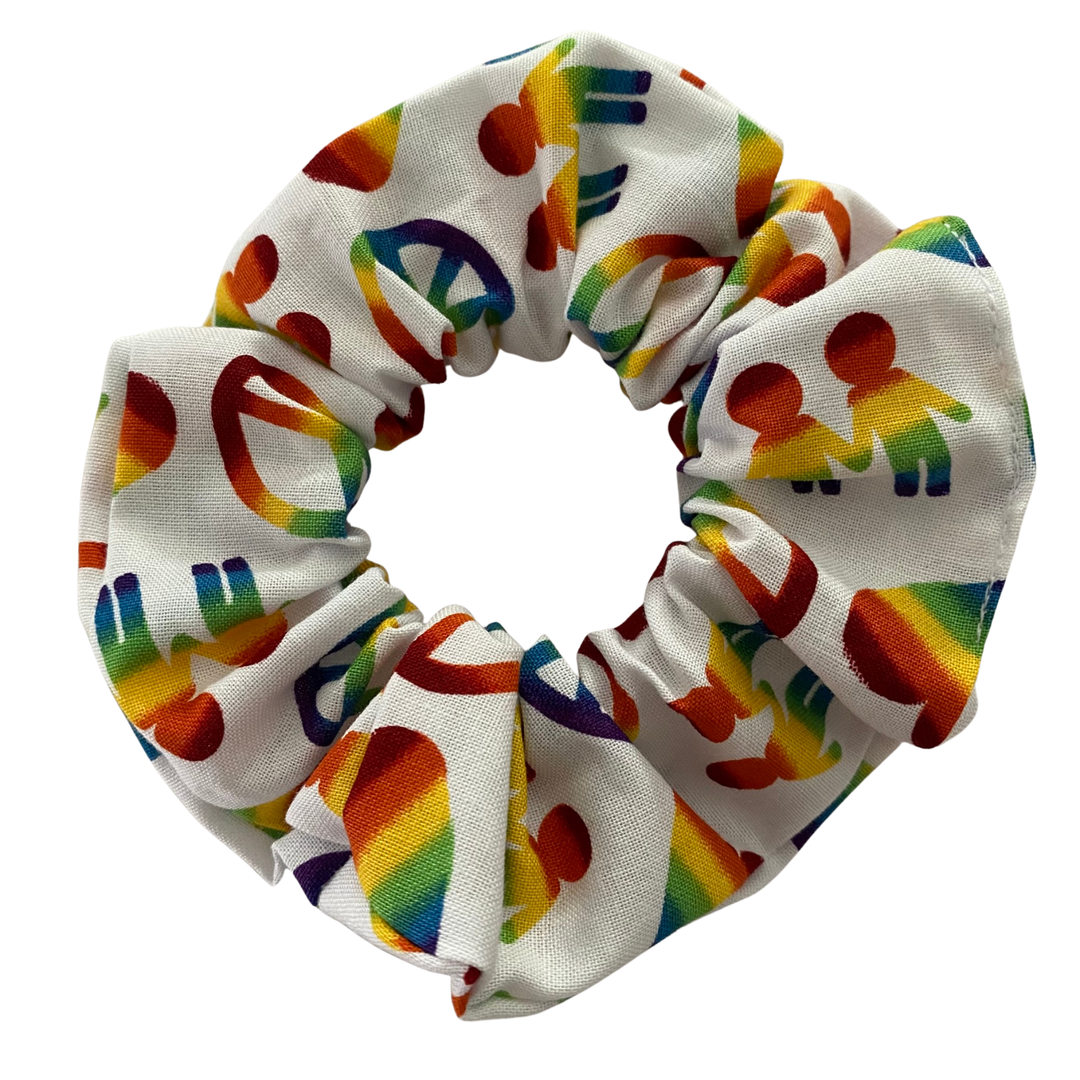 A scrunchie featuring vibrant rainbow hearts, peace signs and hand-holding figures on a white background.