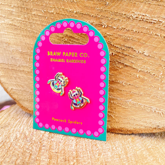 A pair of Peacock Spider enamel stud earrings on backing card.