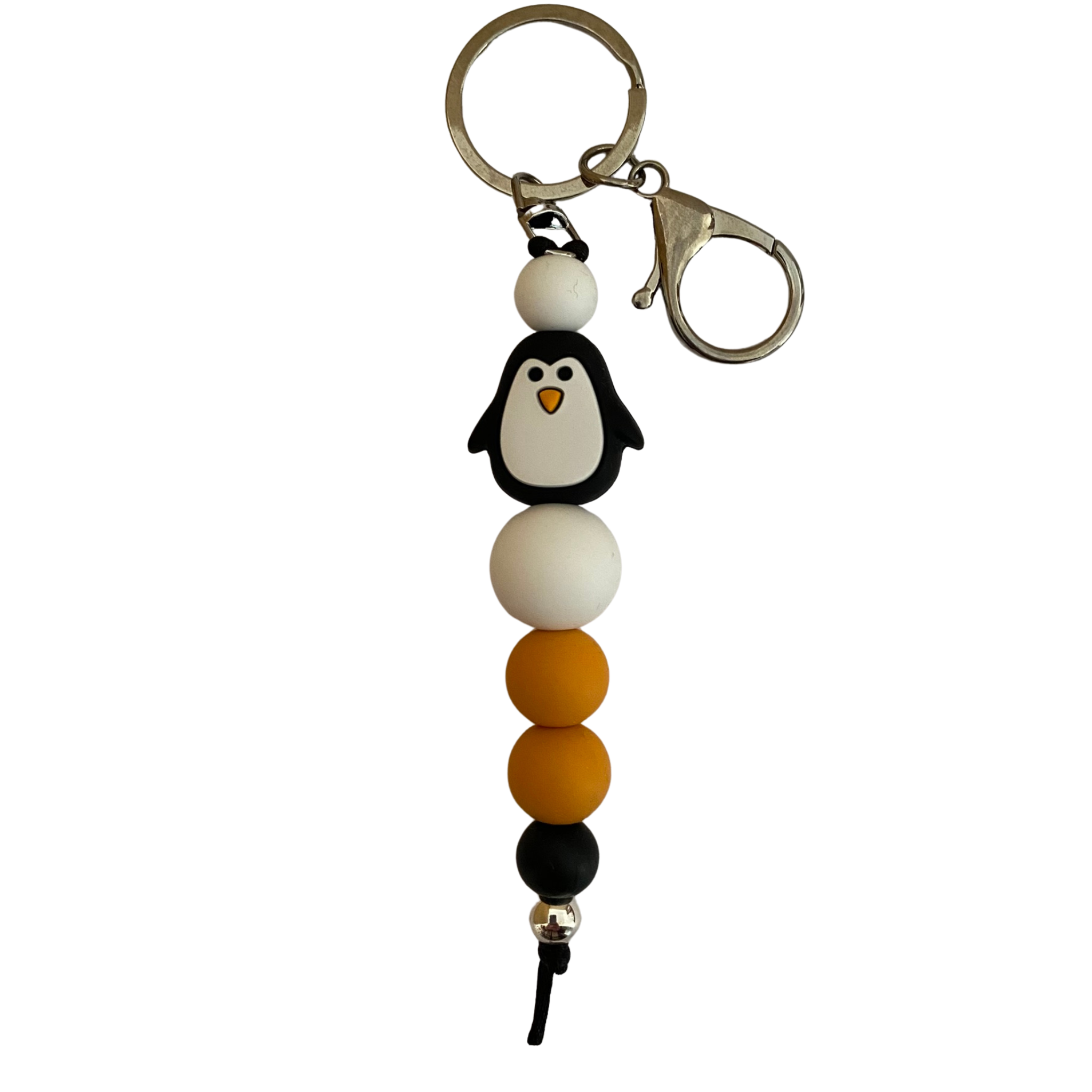 A keyring with a penguin silicone bead and other round silicone beads.