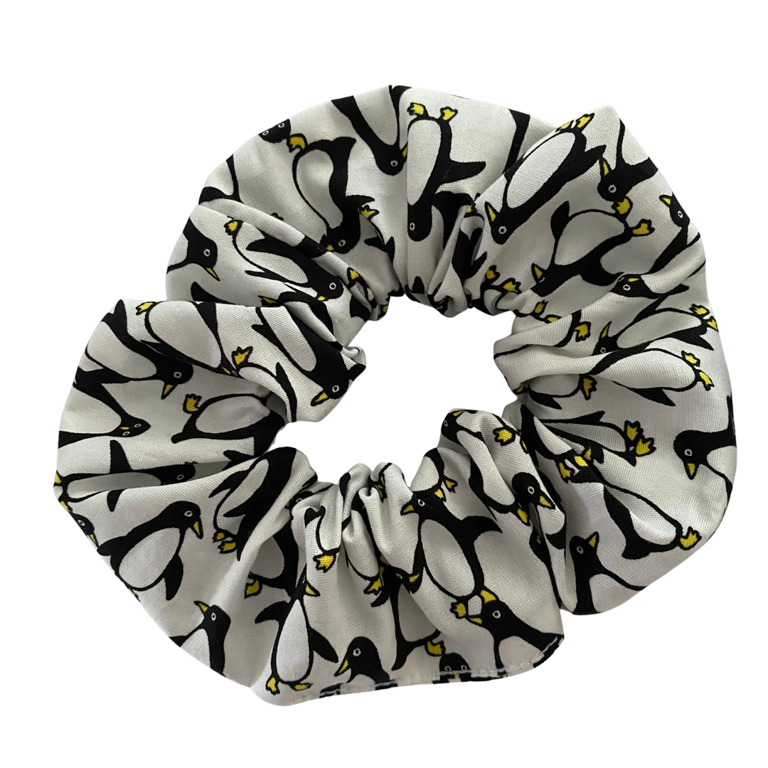 Scrunchie with penguin pattern on a white background.