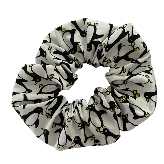 Scrunchie with penguin pattern on a white background.