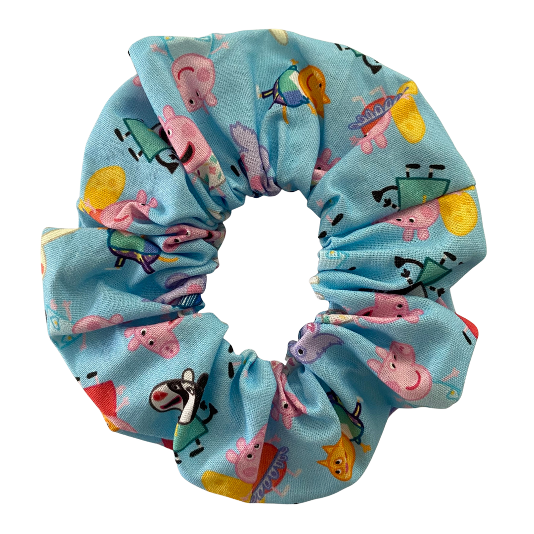 Blue scrunchie with Peppa Pig characters on a white background.