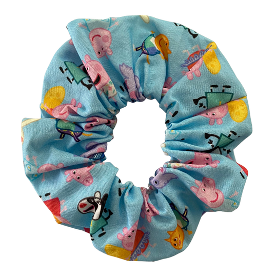Blue scrunchie with Peppa Pig characters on a white background.