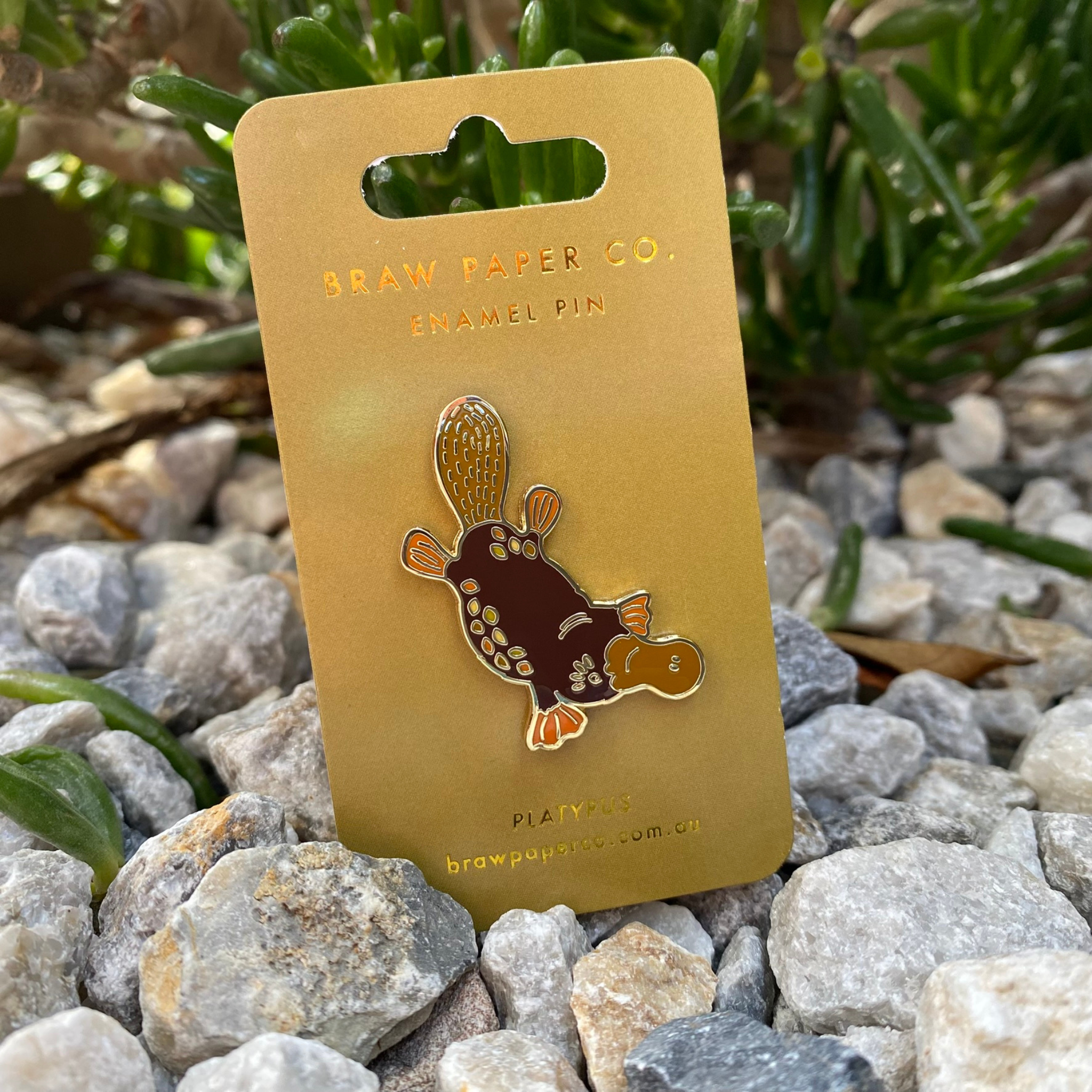 A platypus enamel pin approx 3.8cm in height.